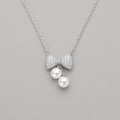 Ethereal Pavé Bow & Twin Pearl Pendant