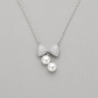Ethereal Pavé Bow & Twin Pearl Pendant