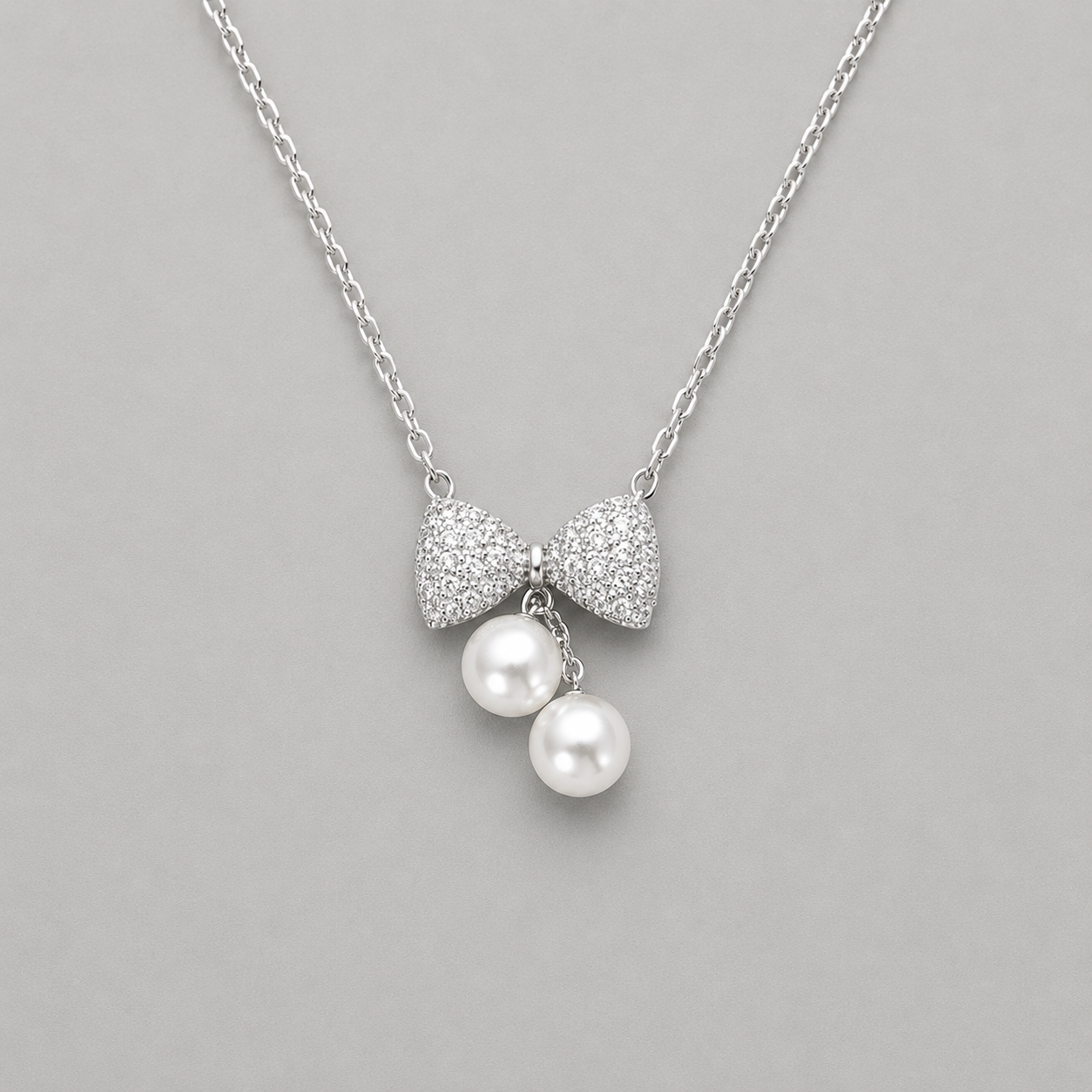 Ethereal Pavé Bow & Twin Pearl Pendant